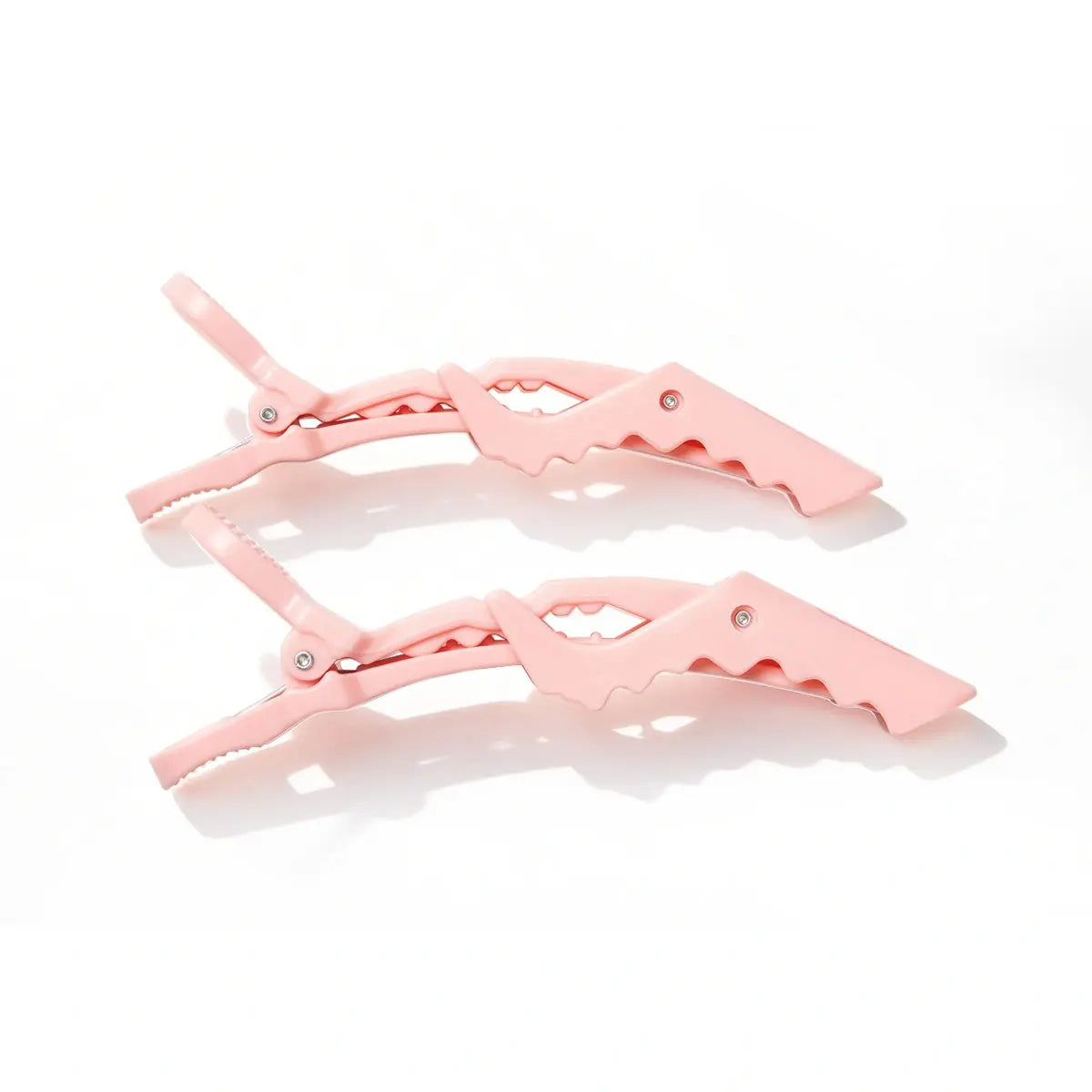 Pair of pink TYMO Alligator Sectioning Clips featuring flexible double-hinged joints and ergonomic anti-slip serrated teeth for secure grip