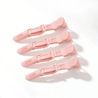 Set of four pink TYMO Alligator Sectioning Clips arranged on a clean white background