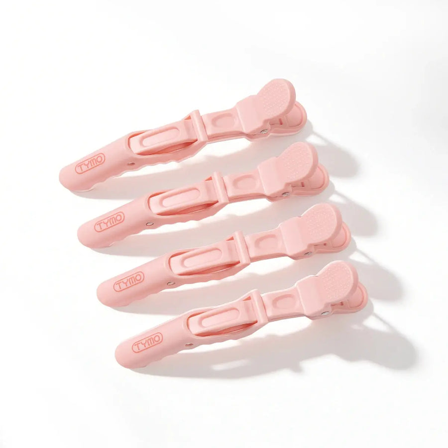 Set of four pink TYMO Alligator Sectioning Clips arranged on a clean white background