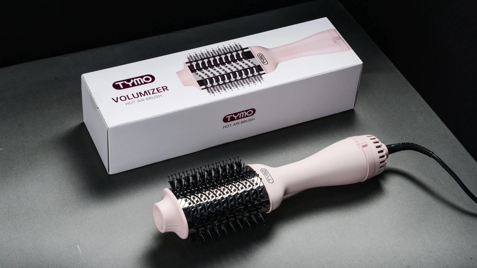 Complete package of TYMO VOLUMIZER PINK ceramic blow dryer brush.